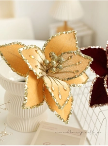 Detail of a 26cm golden velvet Christmas flower with sequins and rhinestone accents