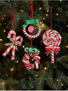 Set of four red, white, and green clay Christmas candy pendants with red silk ribbons