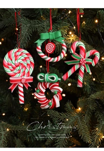 Detailed view of red, white and green candy cane ornaments hanging on a Christmas tree