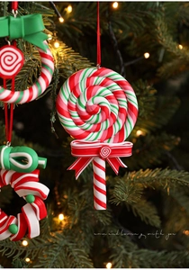 Macro detail of red green and white spiral candy ornament hanging on a Christmas tree
