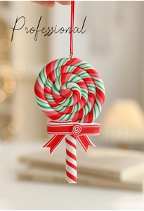 Close-up of red, green and white spiral Christmas lollipop ornament with red ribbon bow