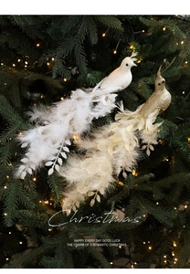 Detail of glittered gold and white artificial birds with feathers on Christmas tree