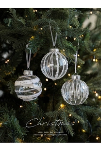 Detail of 8cm transparent Christmas balls with white stripes and pearl texture on a tree