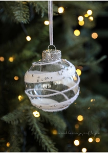 Detail of clear 8cm Christmas ball with white velvet stripes and sparkling silver accents