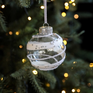 8cm clear Christmas ball with white velvet stripes and silver studs on green tree