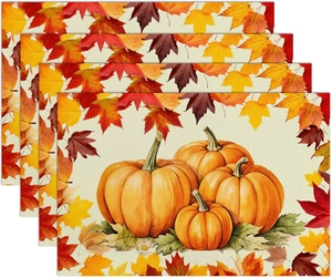 Set of four linen placemats featuring autumn pumpkin and maple leaf patterns for Thanksgiving