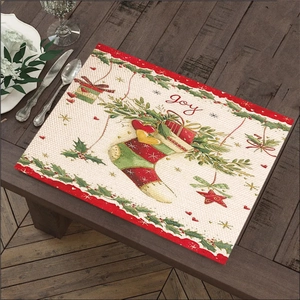 Detailed view of linen Christmas placemat with Joy text and festive holiday ornaments