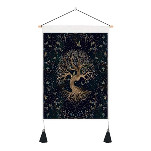 Detail of Tree of Life tapestry featuring gold patterns, black tassels and wooden hanging rod