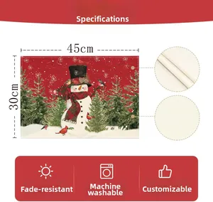 Close-up of linen Christmas placemat showing woven texture and festive snowman pattern