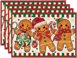 Set of 4 Christmas placemats featuring gingerbread men and red green plaid borders