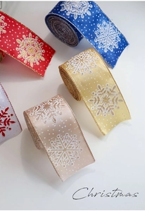 Detailed view of Christmas snowflake ribbons with glitter edges for gift wrapping