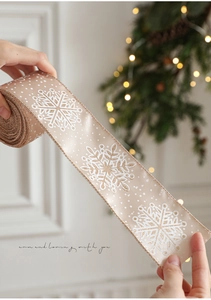 Champagne satin ribbon with white dots and gold glitter snowflakes for festive decor