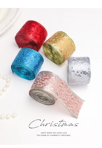 Detail of five-color sequined Christmas ribbons with silver edges and festive branding