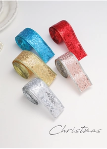 Close-up of five colorful sequin ribbons for Christmas gift wrapping and decor