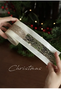 Detail of champagne gold glitter mesh ribbon with cream satin edges for Christmas decor