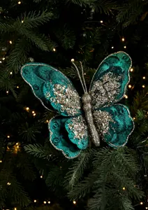 Detailansicht der dunkelgrünen Samt-Weihnachtsschleife mit Goldglitzer am Tannenbaum