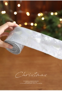 Silver Christmas ribbon with festive glitter trees and holiday greetings for gift wrapping