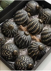 Detail of vintage 8cm Christmas ornaments with gold relief patterns in a premium gift box