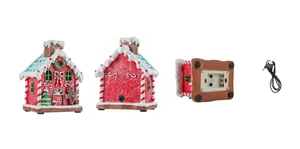 Detail view of the Christmas gingerbread house base with dual USB and battery power ports