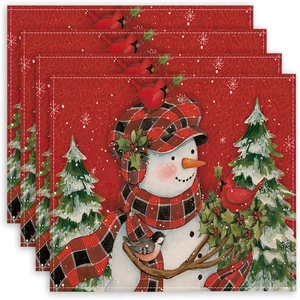 Set of 4 Christmas linen placemats with festive snowman and snowflake prints
