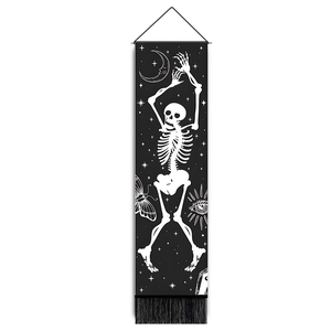 Detailed view of gothic tapestry featuring dancing skeleton with black tassels and mystical icons