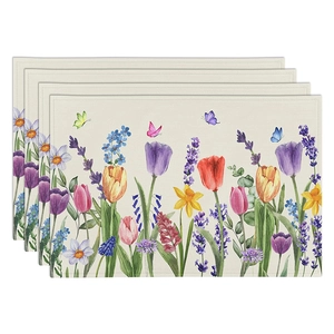 Close-up of four linen placemats featuring watercolor tulip and lavender floral prints