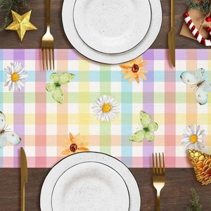 Spring bunny plaid table runner with daisy floral print on dark wood dining table
