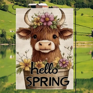 Macro detail of Highland cow floral flag hanging on a black metal pole in a spring garden