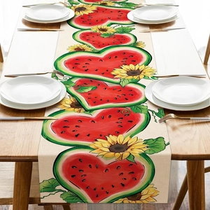Close-up of summer floral table runner with sunflower and watermelon print on linen fabric