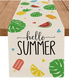 Detail of summer table runner with watermelon, pineapple and hello summer print on wood