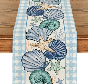 Detailed texture of ocean theme table runner with blue checkered edges and starfish prints