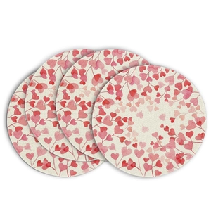 Set of four round linen placemats with watercolor pink heart leaf prints for home decor
