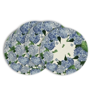 Detailed close-up of four round linen placemats with blue hydrangea floral print