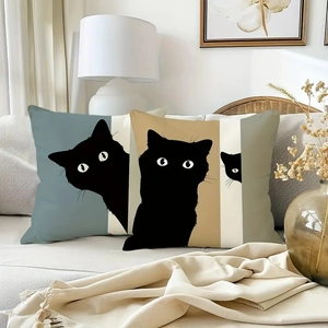Modern vintage cat art linen pillow covers featuring black cat illustrations on sofa