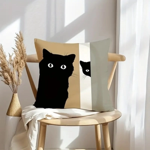 Detail of minimalist black cat silhouette pillow case on wooden chair with natural light