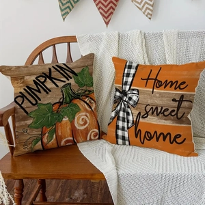 Set of autumn linen pillow covers with pumpkin patterns and Home Sweet Home text decor