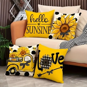 4er-Set herbstliche Kissenbezüge mit Sonnenblumen und gelbem LKW auf Sofa