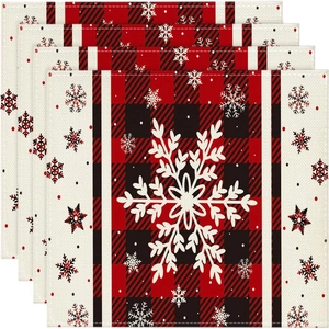 Set of 4 Christmas linen placemats featuring large white snowflakes and buffalo plaid