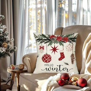 Christmas pillow cover with Hello Winter print and festive ornaments on a sofa