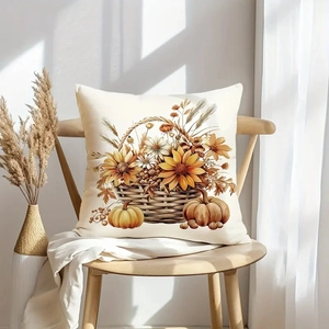 Close-up of autumn harvest pillow with pumpkin and sunflower motifs on a wooden chair
