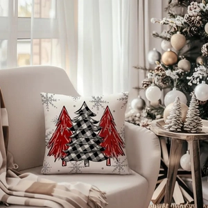 Christmas cushion cover with three festive trees on a cozy beige sofa backdrop