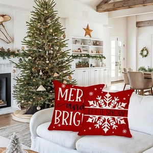 Detail of red Christmas pillow covers with Merry and Bright and Let It Snow slogans