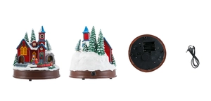 Détail du port USB, du compartiment à piles et du sélecteur de mode sur le socle du village