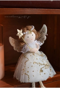 Detailed view of plush angel ornament with reindeer antlers and sparkling white tulle dress