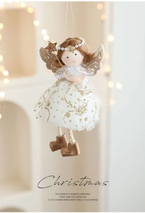Detail of Christmas angel pendant with golden star wand and sequined white mesh dress