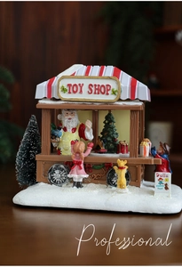 Detailed view of resin toy shop miniature with Santa and snow-covered base