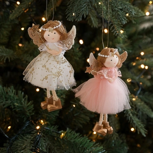 Plush Christmas angel dolls with gold antlers and wings hanging on a festive tree