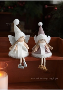 Detailed view of handmade Christmas plush angel ornaments with knit hats and glitter wings
