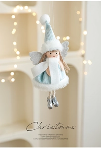 Detail of blue plush Christmas angel ornament with silver glitter wings and knit textures