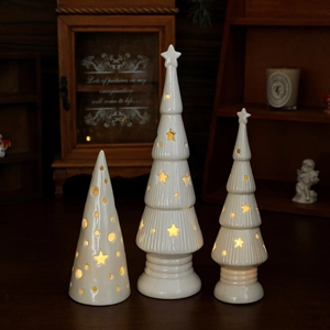 Three-piece set of white ceramic Christmas tree night lights with warm LED glow